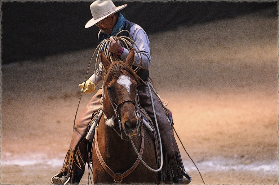 Sam on horseback coiling rope in arena