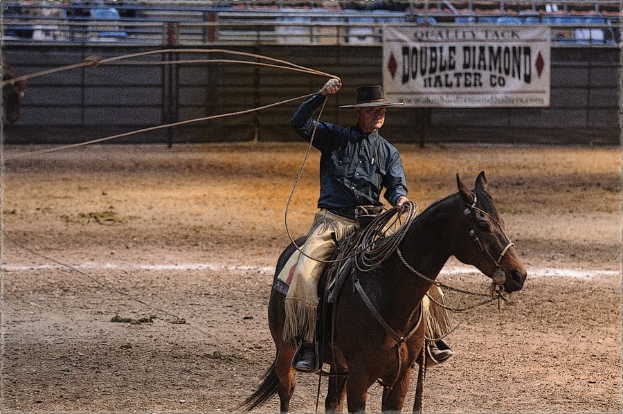 Dave roping on horseback in the arena